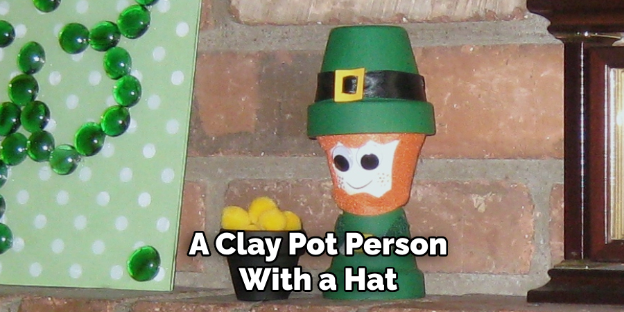 A Clay Pot Person With a Hat