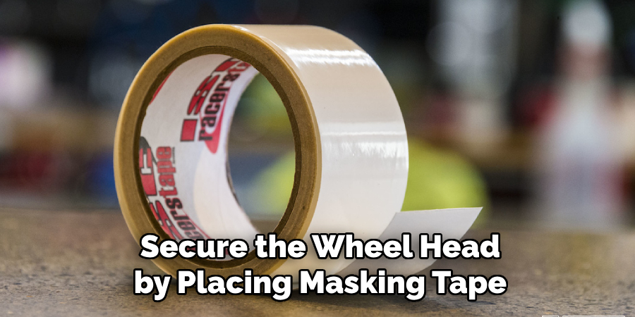 Secure the Wheel Head by Placing Masking Tape