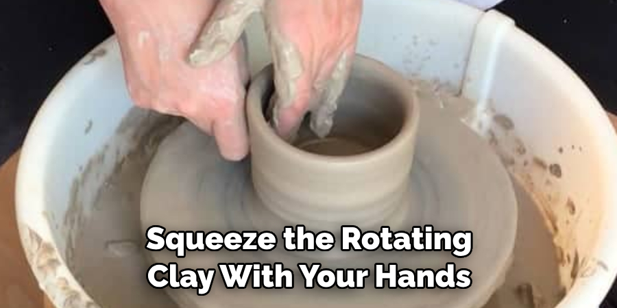 Squeeze the Rotating  Clay With Your Hands