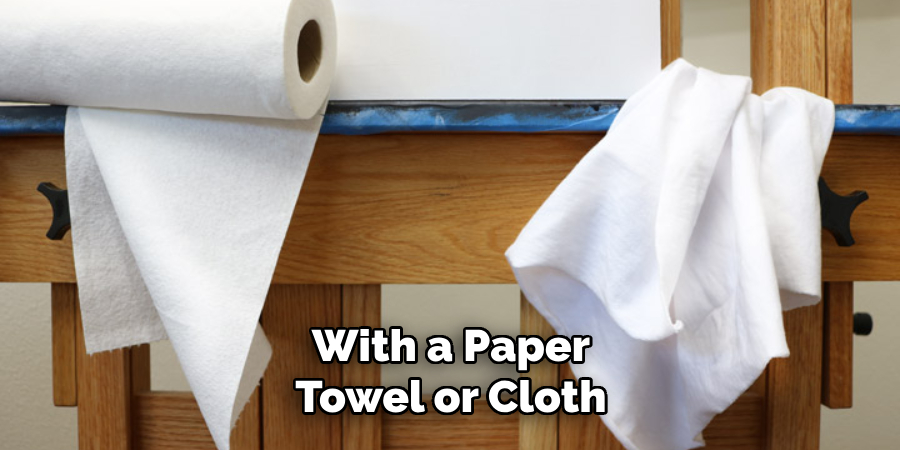 With a Paper Towel or Cloth