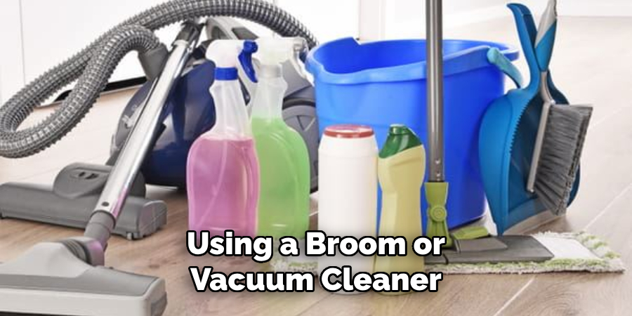 Using a Broom or Vacuum Cleaner