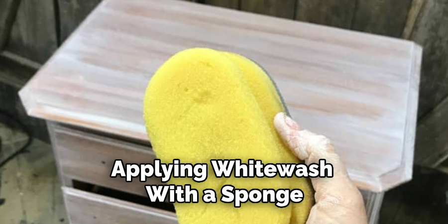 Applying Whitewash With a Sponge