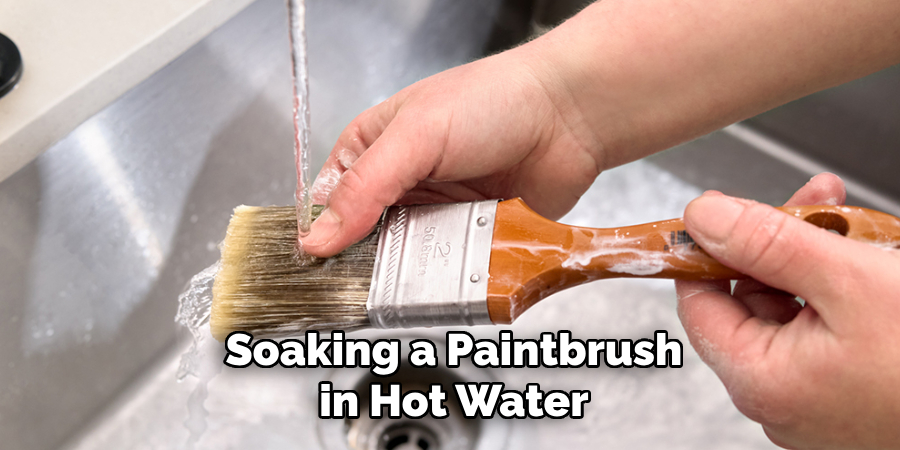 Soaking a Paintbrush in Hot Water