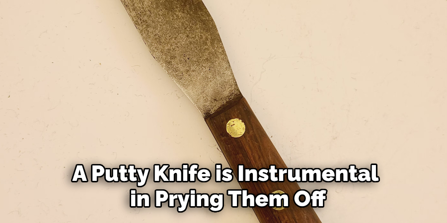 A Putty Knife is Instrumental in Prying Them Off